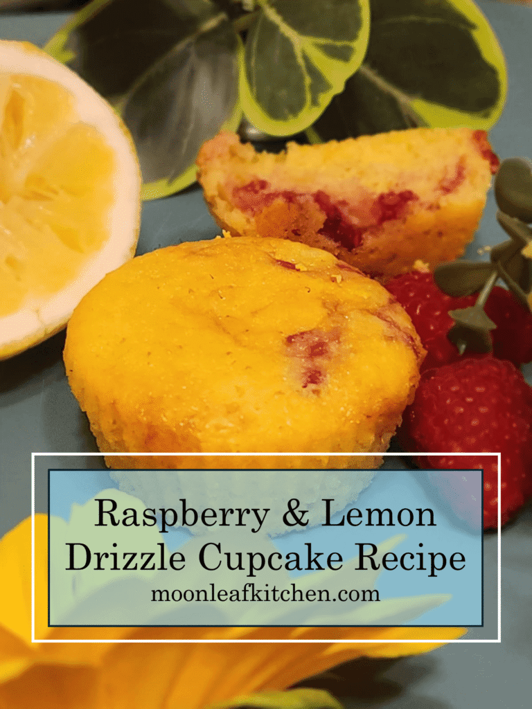Easy Lemon Drizzle Cupcakes with Raspberry Swirl A close-up of a lemon drizzle cupcake with a vibrant raspberry swirl, with a second cupcake split in half in the background to show the marbled interior. Set against a bright, colorful background.