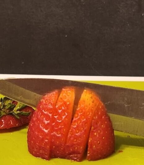 Sweet & Summery Strawberry Avocado Salad chopping strawberries